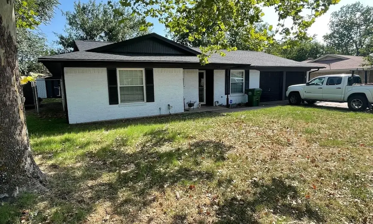 Professional roofing crew working on a residential roof in West Falls Church